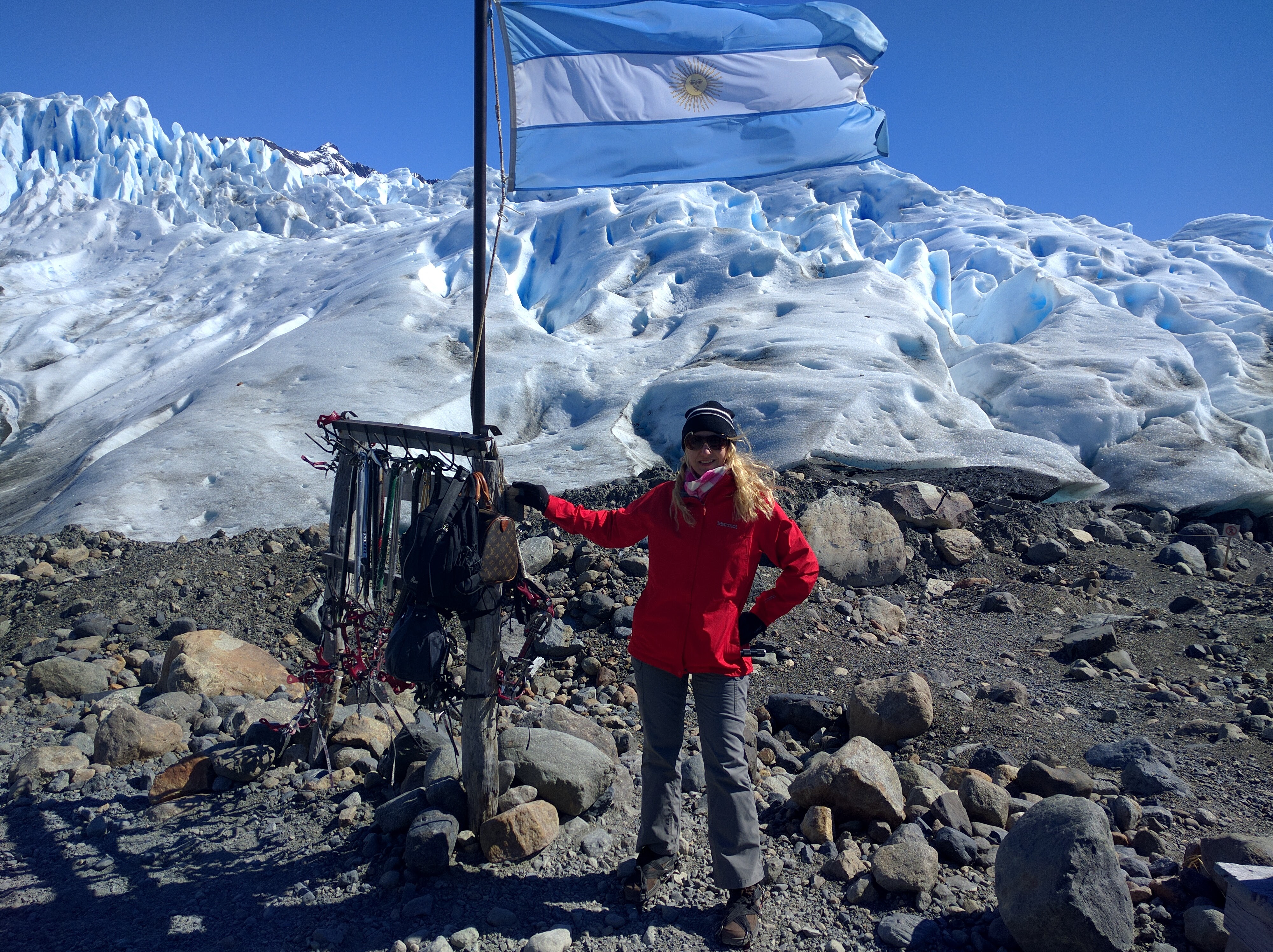 Girl standing at the edge of Perito Moreno Glacier in Patagonia