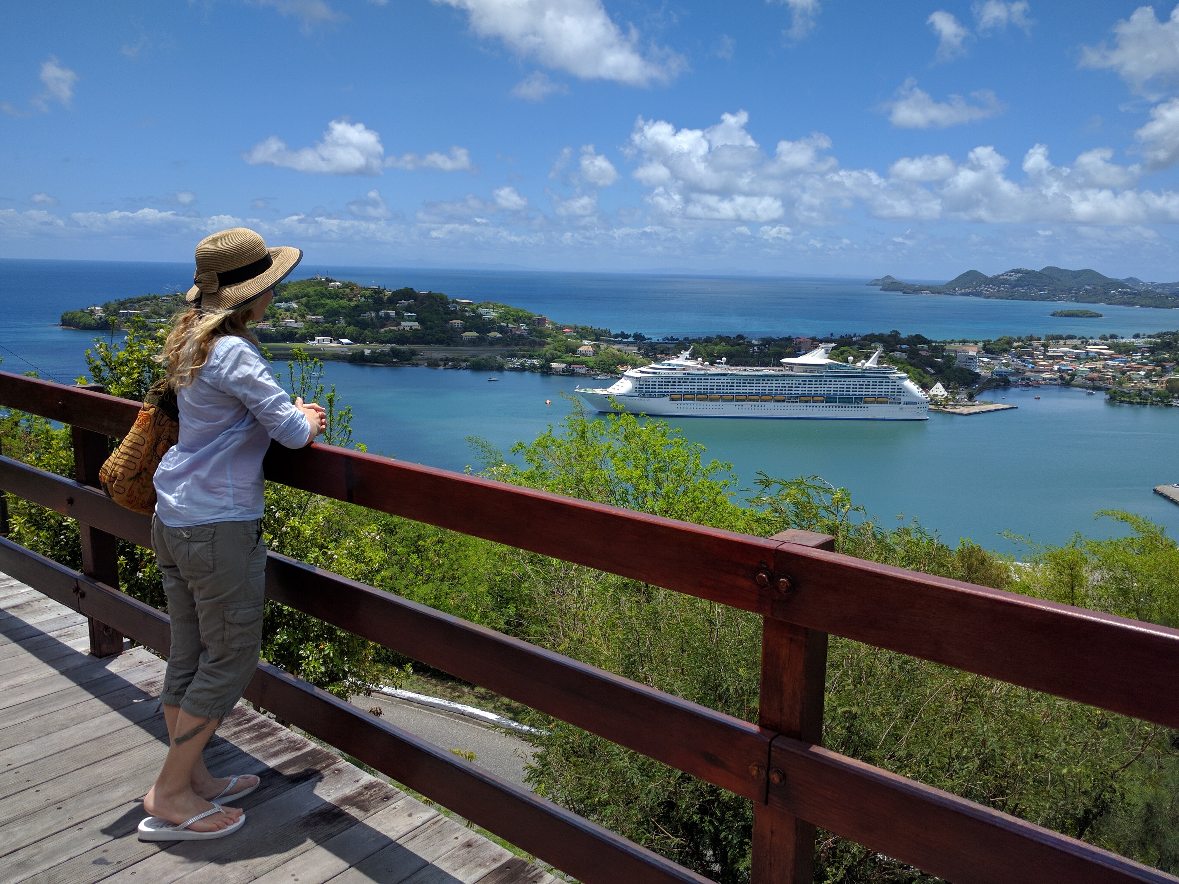 Girl overlooking a bay in St Lucia on a beautiful sunny day